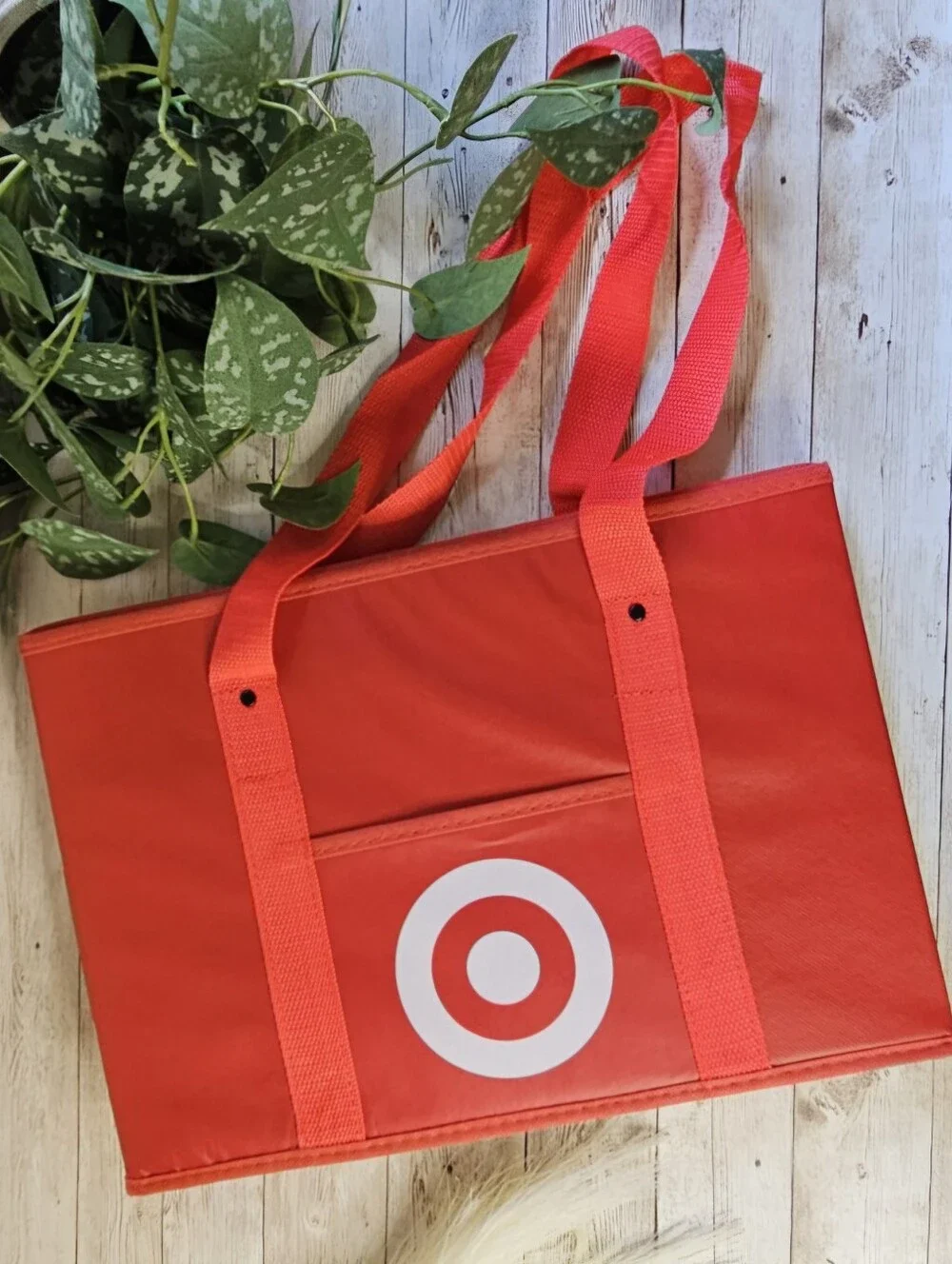 Target red collapsible box-style utility bag. It features a rectangular, boxy sh